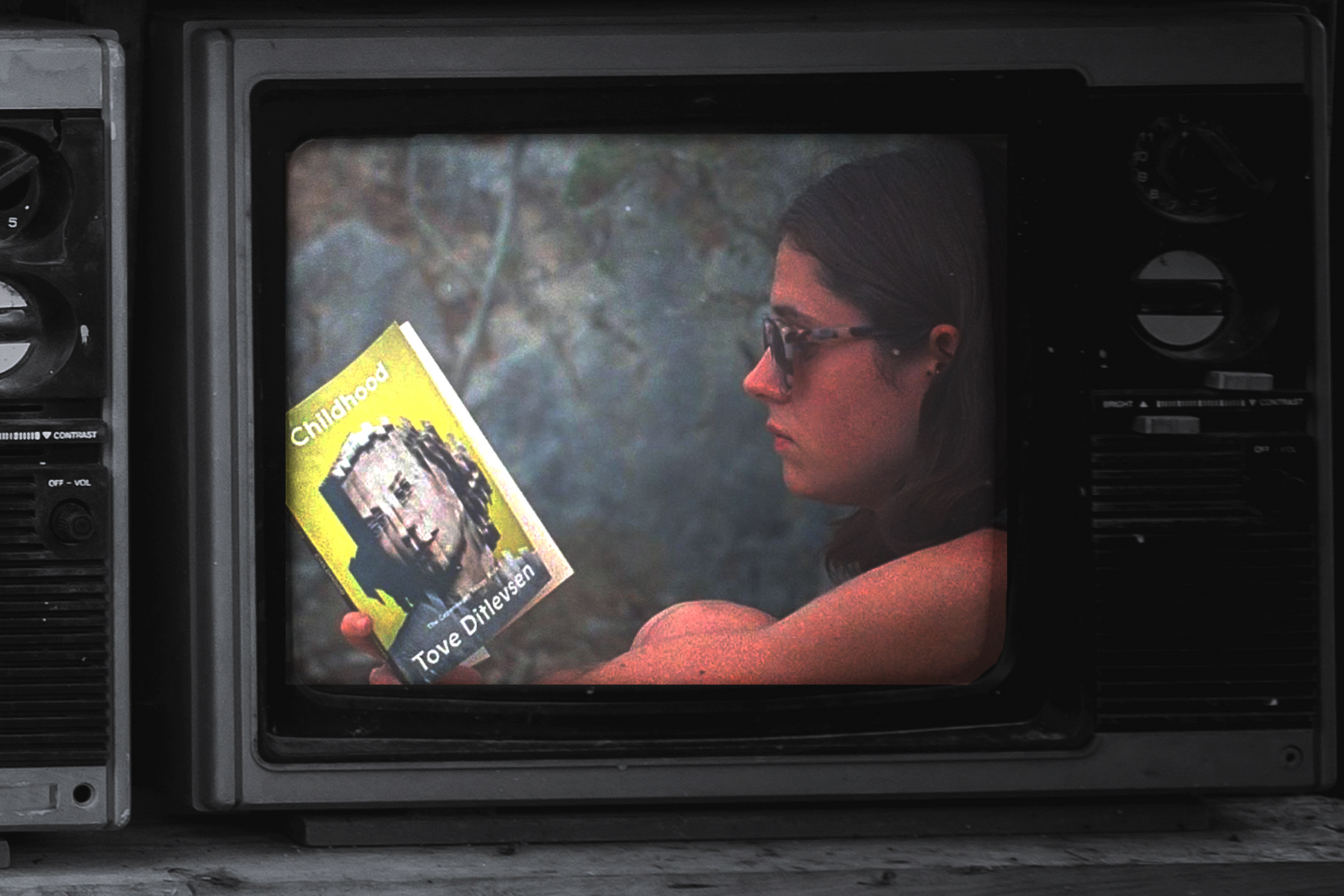 A TV still of a character from Conversations With Friends reading Tove Ditlevson